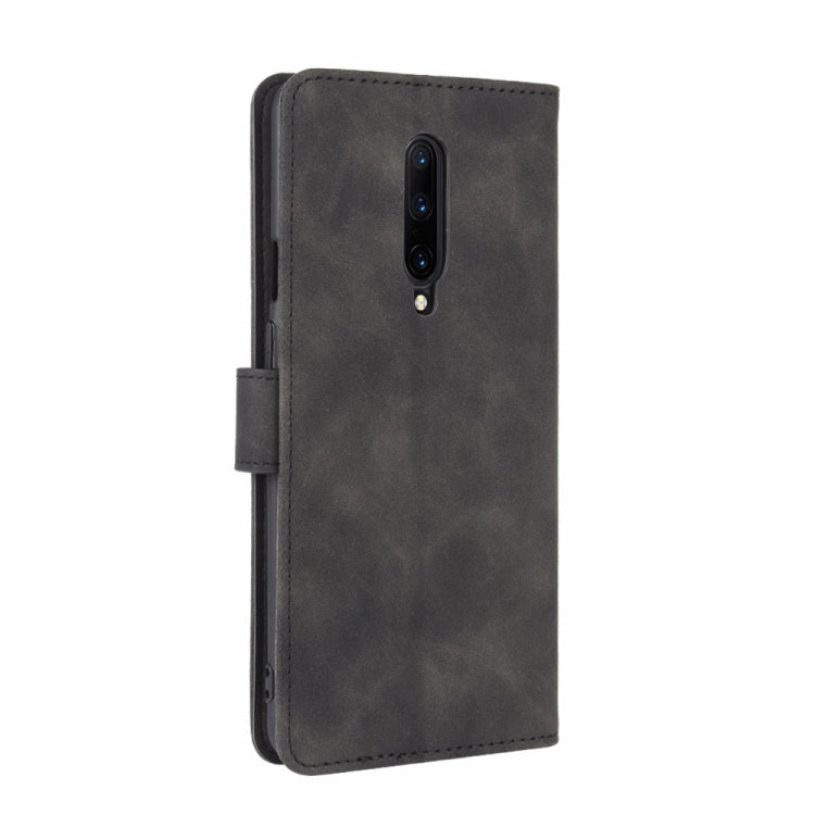 For OnePlus 7 Pro Solid Color Skin Feel Magnetic Buckle Horizontal Flip Calf Texture PU Leather Case with Holder & Card Slots & Wallet(Black)