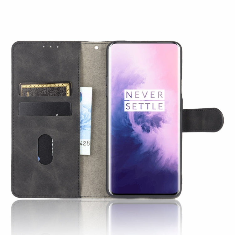 For OnePlus 7 Pro Solid Color Skin Feel Magnetic Buckle Horizontal Flip Calf Texture PU Leather Case with Holder & Card Slots & Wallet(Black)