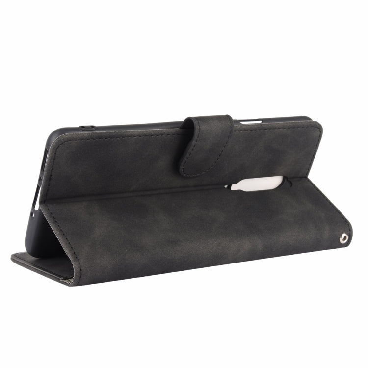 For OnePlus 7 Pro Solid Color Skin Feel Magnetic Buckle Horizontal Flip Calf Texture PU Leather Case with Holder & Card Slots & Wallet(Black)