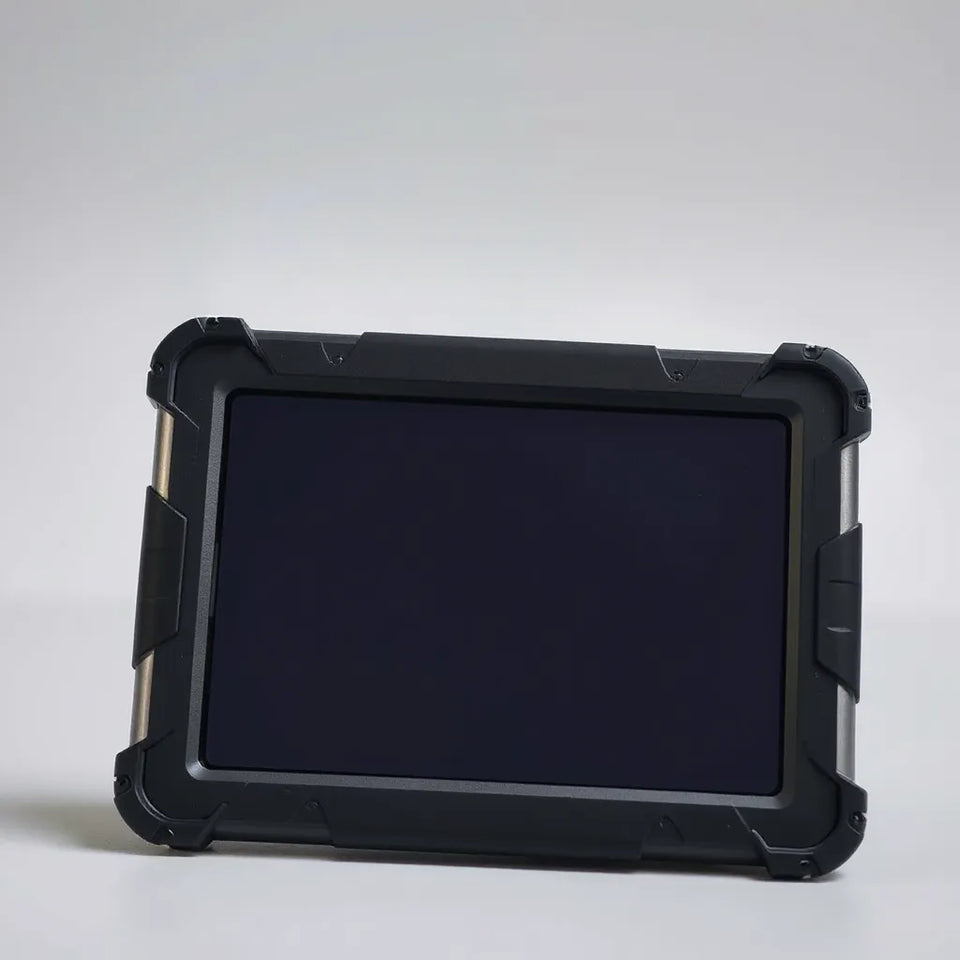 Rugged shock-resistant tablet cover with reinforced corners beside a tablet on a neutral background