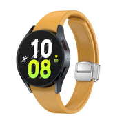 For Samsung Galaxy Watch 6 Magnetic Folding Silver Buckle Silicone Watch Band(Yellow)