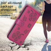 For iPhone 16 Four-leaf Embossed Leather Phone Case(Rose Red)