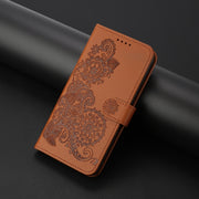 For Google Pixel 9 Datura Flower Embossed Flip Leather Phone Case(Brown)