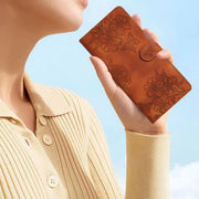 For Samsung Galaxy S25+ 5G Cherry Blossom Butterfly Skin Feel Embossed PU Phone Case(Brown)