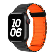 For Apple Watch SE 44mm Tri-beads Magnetic Hoop Silicone Watch Band(Black Orange)