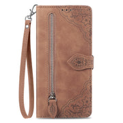 For Google Pixel 9 Embossed Flower Zipper Leather Phone Case(Brown)