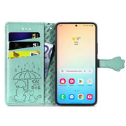 For Samsung Galaxy S25 5G Cat and Dog Embossed Leather Phone Case(Green)