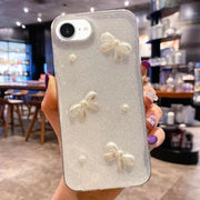 For iPhone 16e Pearl Bow Glitter Epoxy TPU Phone Case(Three Knots)
