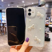 For iPhone 16 Pearl Bow Glitter Epoxy TPU Phone Case(Cross Knots)