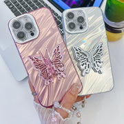 For iPhone 16 Pro Plating Glitter Lens Film Texture Butterfly Holder Wristband Phone Case(White Feathers)
