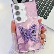 For Samsung Galaxy S25+ 5G Plating Glitter Lens Film Texture Butterfly Holder Wristband Phone Case(Purple Feathers)