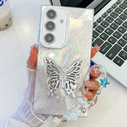 For Samsung Galaxy S25+ 5G Plating Glitter Lens Film Texture Butterfly Holder Wristband Phone Case(White Tinfoil Texture)