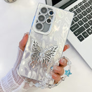 For Samsung Galaxy S25 Ultra 5G Plating Glitter Lens Film Texture Butterfly Holder Wristband Phone Case(White Wrinkles)