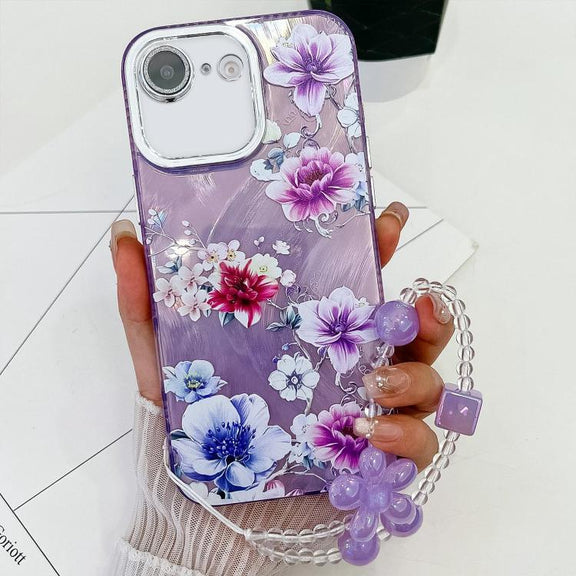 For iPhone 16e Electroplating Flowers Plants Texture Wristband TPU Phone Case(Purple Flowers FL1)