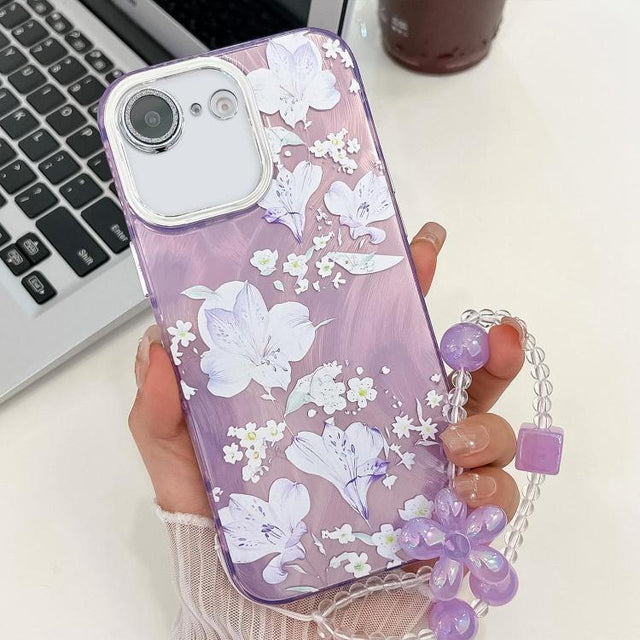 For iPhone 16e Electroplating Flowers Plants Texture Wristband TPU Phone Case(Pale Purple FlowerFL11)