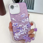 For iPhone 16e Electroplating Flowers Plants Texture Wristband TPU Phone Case(Lilac Flowers FL16)
