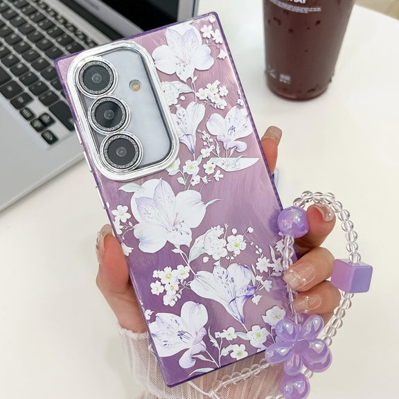 For Samsung Galaxy S25 5G Electroplating Flowers Plants Texture Wristband TPU Phone Case(Pale Purple FlowerFL11)