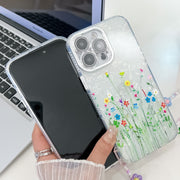 For iPhone 16e Electroplating Flower Texture Wristband TPU Phone Case(Purple Wildflowers SH1)