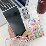 For Samsung Galaxy S25+ 5G Electroplating Flower Texture Wristband TPU Phone Case(Wild Chrysanthemum SH5)