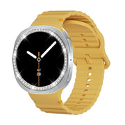 For Samsung Galaxy Watch8 40mm Diamond Bezel and Wavy Grain Stitched Color Buckle Silicone Watch Band(Yellow Silver)