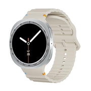 For Samsung Galaxy Watch8 40mm Speed Bezel and Wavy Grain Stitched Color Buckle Silicone Watch Band(Beige Silver)