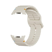 For Samsung Galaxy Watch8 40mm Speed Bezel and Wavy Grain Stitched Color Buckle Silicone Watch Band(Beige Silver)