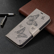 For Xiaomi Redmi Note 12 4G Global Two Butterflies Embossing Leather Phone Case(Grey)