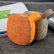 X25new Cloth Texture Square Portable Mini Bluetooth Speaker, Support Hands-free Call & TF Card & AUX(Orange)